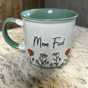 Super cute Mom Fuel mug with sweet little orange and yellow flowers.